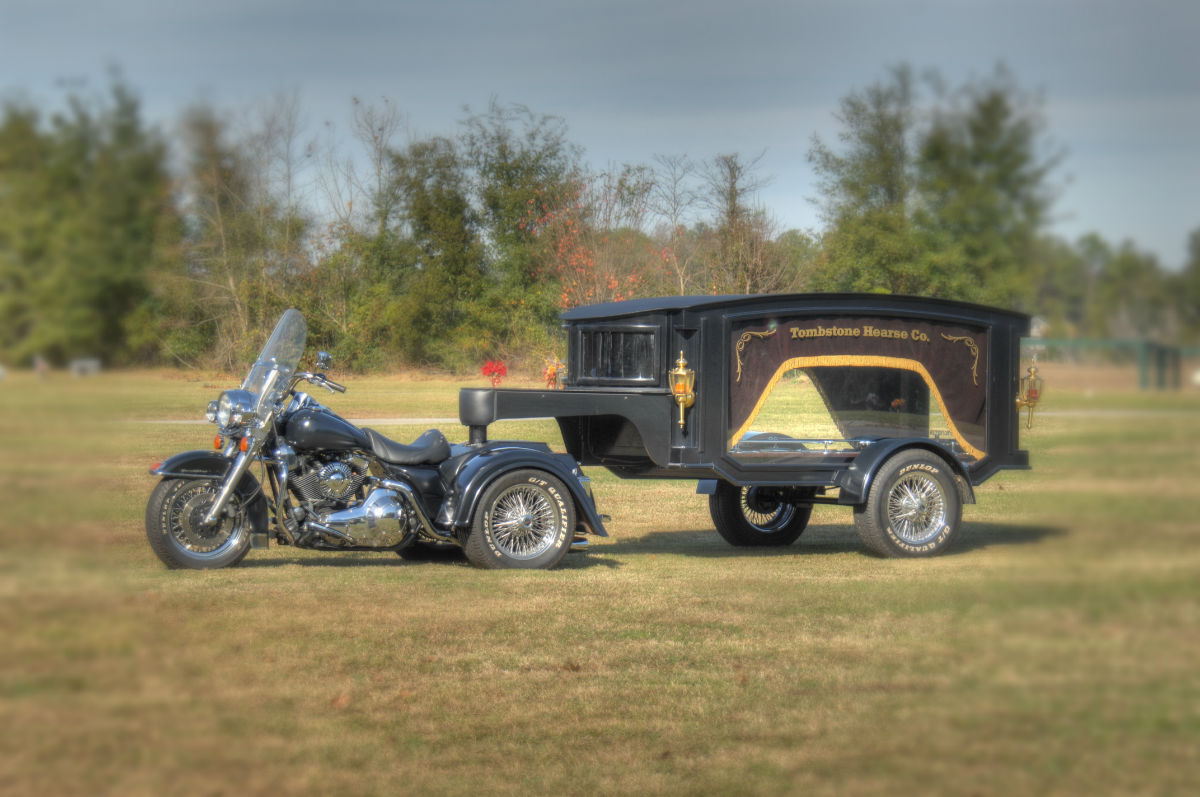 motorcycle driving a hearse